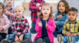 Young children singing Christmas songs at nursery